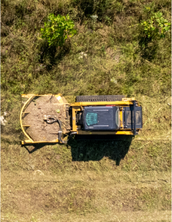 skid steer clearing brush